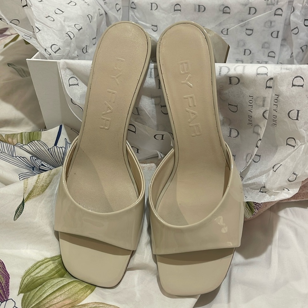 BY FAR Patent Leather Slide Sandals in Beige